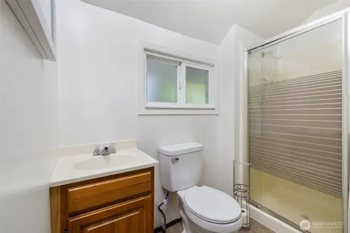 3/4 bath with walk in shower- could easily be converted to a tub/shower combo.