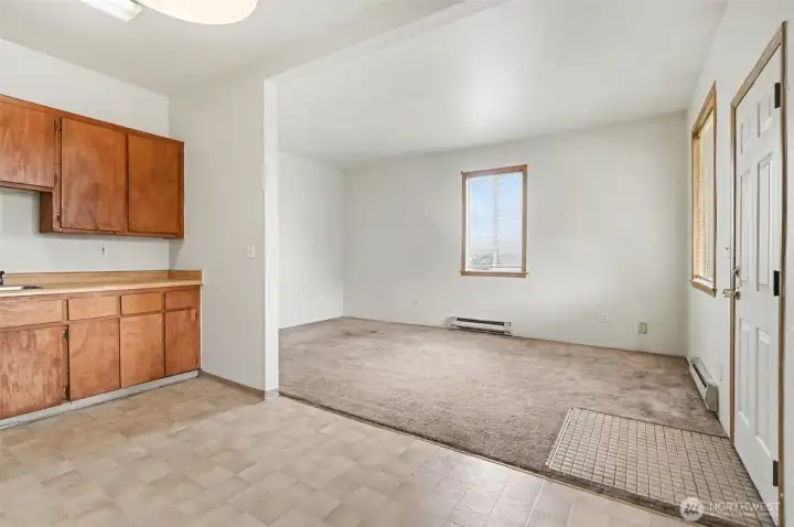 Connected living room and kitchen.