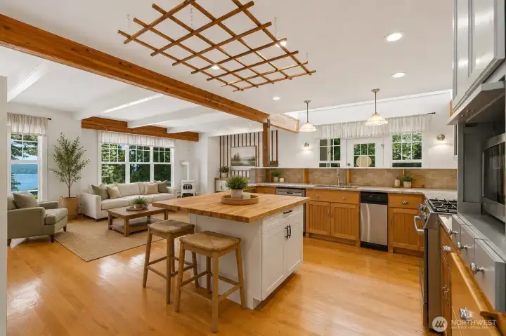 Virtually staged. Generous open-concept living space with seamless flow between the kitchen, dining, and living areas.