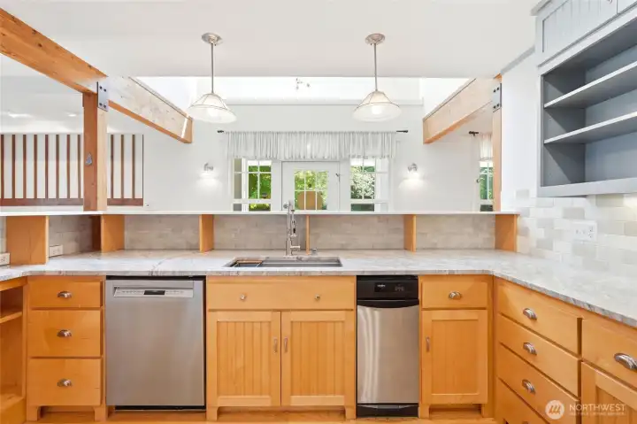 The heart of the home, this spacious kitchen offers abundant cabinetry, expansive countertops, and an open-concept design.