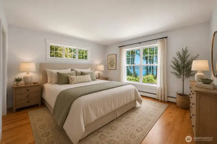 Main level primary bedroom with beautiful views, walk in closet and full bath.