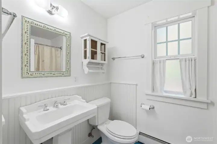 Charming full bathroom in the primary bedroom.