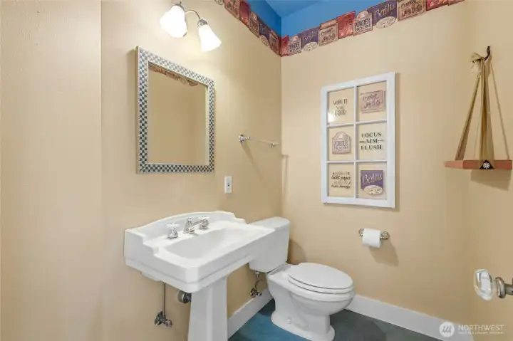 Entry way half bathroom full of character.