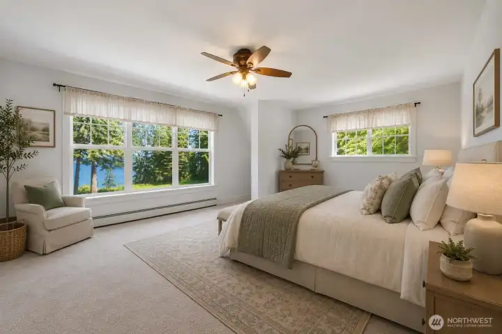 Virtually staged. Wake up to beautiful water views from this spacious upstairs bedroom, complete with a large walk-in closet.