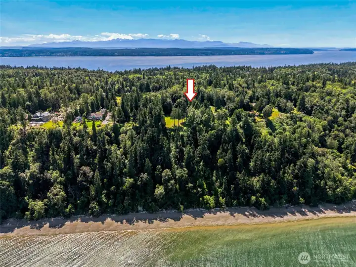 Beach access is available via nearby roads, allowing you to park nearby and stroll the shoreline to your private stretch of waterfront while enjoying breathtaking water and mountain views.