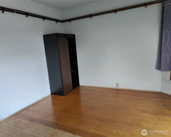Bedroom #2 upstairs small armoire to left of window with AC