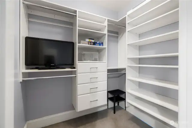 The walk-in closet is enhanced by a custom California Closet system, maximizing storage space with a blend of style and functionality. Perfect for keeping everything organized and accessible