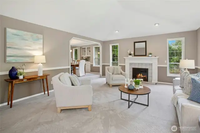 Gorgeous, spacious living room complete with a cozy gas fireplace.