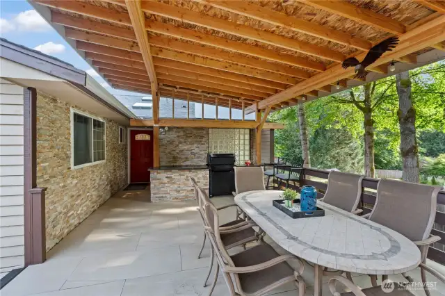 Spacious covered patio with outdoor cooking area