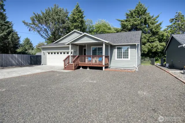 Low maintenance front of home provides plenty of parking space, with room for an RV if desired.