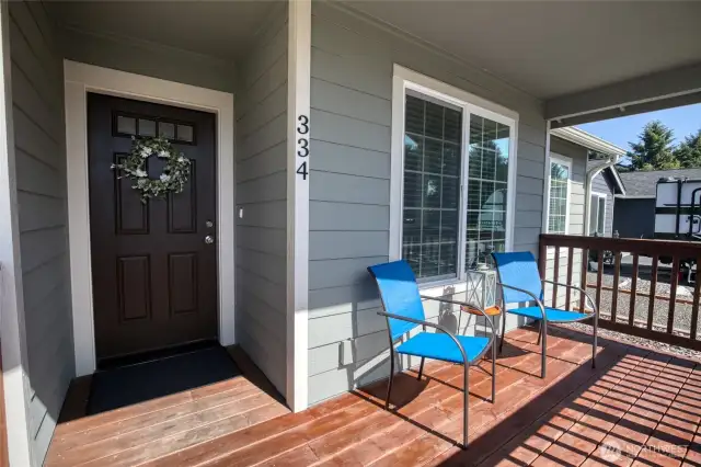 The covered front deck is a peaceful, welcoming place to sit and watch the local wildlife strolling by.