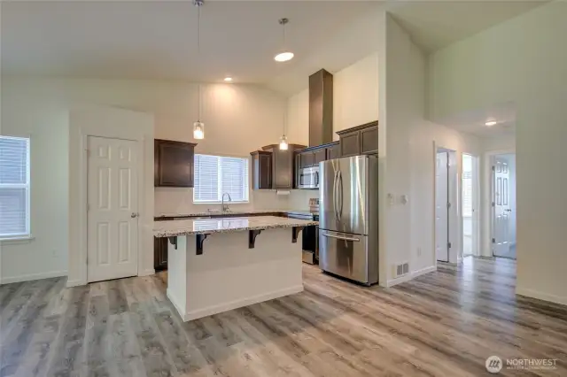 Off the kitchen, you will find the main bath and two bedrooms.
