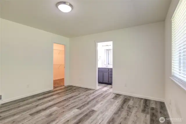 Primary suite features a walk in closet and en-suite bathroom.