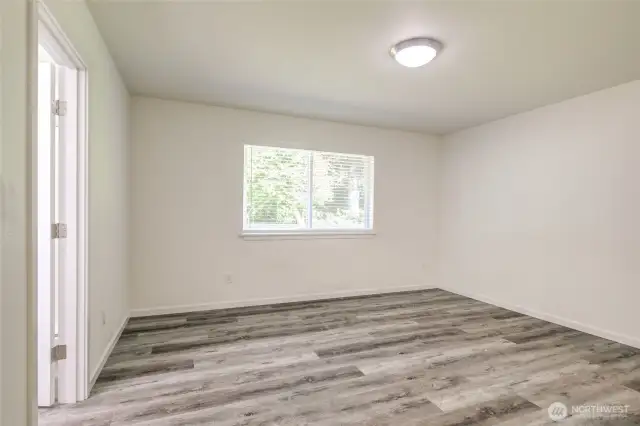 Primary suite overlooks the peaceful back yard.
