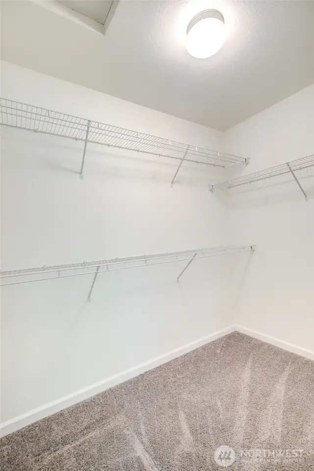 Walk in closet in the primary suite.