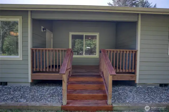The deck leads down into the fully fenced back yard.