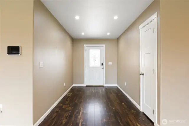 Foyer entry of home - LVP flooring, recessed lighting