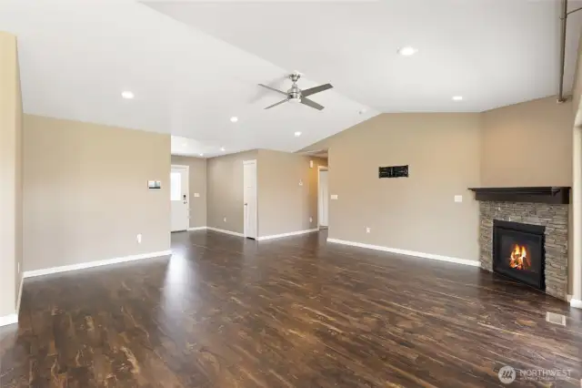 Great room looking toward fireplace, hallway & front entryway