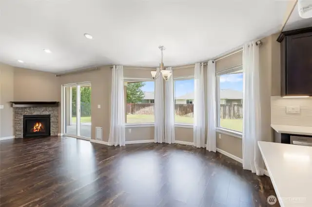 Dining area with large windows to backyard & lots of natural light