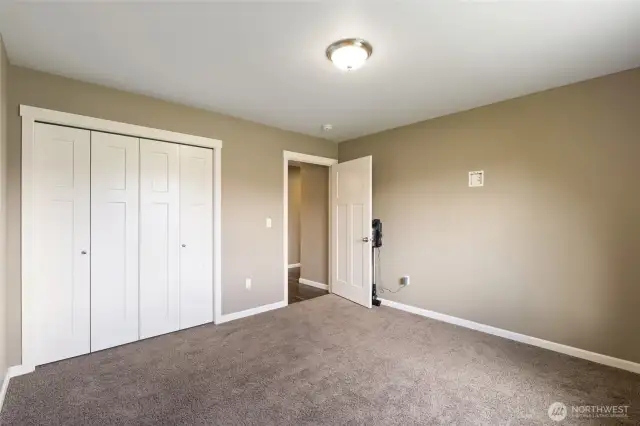 Secondary Bedroom #1 - view front inside toward closet & entry