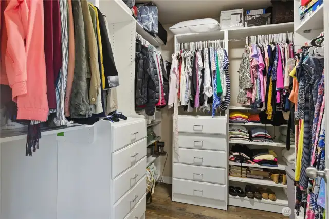 Custom walk-in closet in primary bedroom