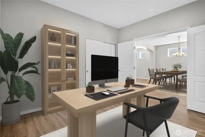 Versatile main level bedroom that can be used as a flex space for office, playroom, media room, guest suite, etc (virtually staged)