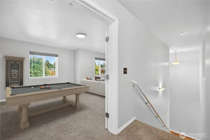 Spacious second-level multipurpose bonus room, virtually staged as a combination media/TV room and game/play area, easily functions as separate areas (virtually staged)