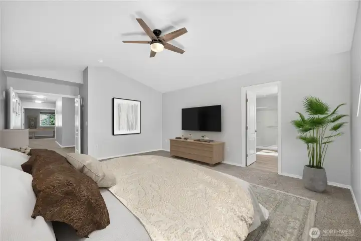 View from primary bedroom into ensuite and hallway to bonus room. (virtually staged)