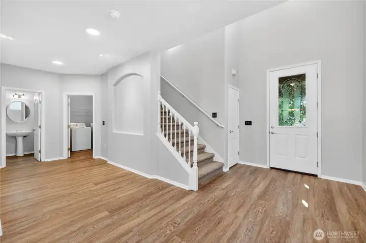 View of entrance, powder bath and laundry room.