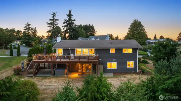 Big deck, covered patio area, hot tub, & more!