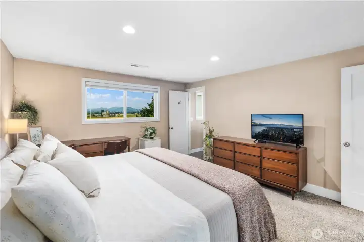 Main-floor primary bedroom... Still have the view!