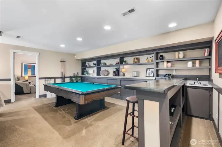 & an impressive full wet bar, ideal for hosting or multigenerational living.