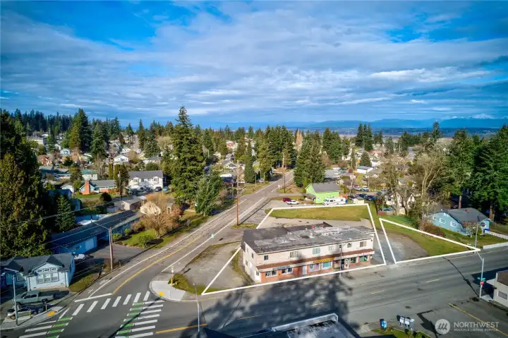 Dynamic mixed-use asset in Everett’s revitalizing urban core. Interurban Crossing spans a 26,572 SF corner lot with alley access, 20+ parking spaces, and a 7,629 SF structure leased to stable local tenants—3 storefronts, 3 apartments, and 3 flex spaces. Current gross rent over $64K; pro forma $144K+ with light upgrades. Just 26.3% lot coverage—NB zoning + Opportunity Zone offer phased development potential. Steps from the Interurban Trail, future light rail, and new stadium district. A walkable, well-connected location with built-in income and big upside....