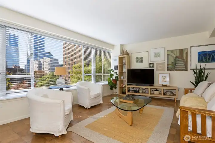 Walls of windows frame downtown views.