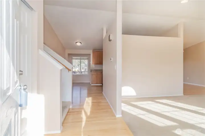 Front entry to wide open living room and access to all levels.