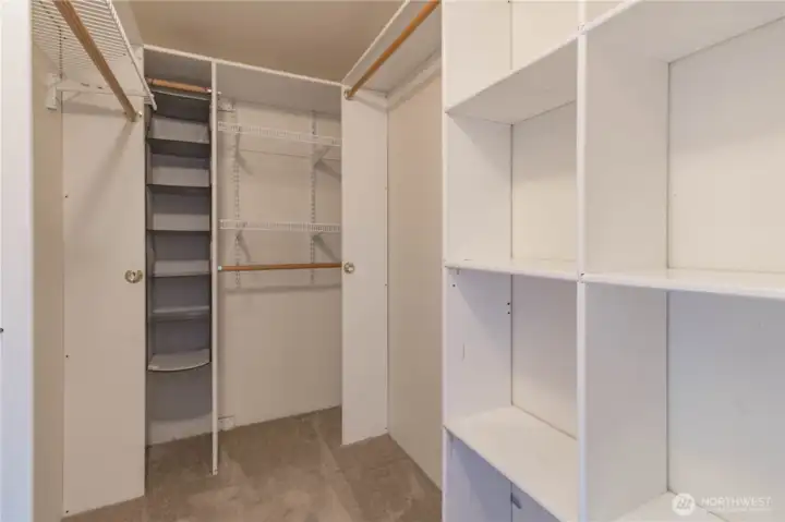 Primary closet with closet system.