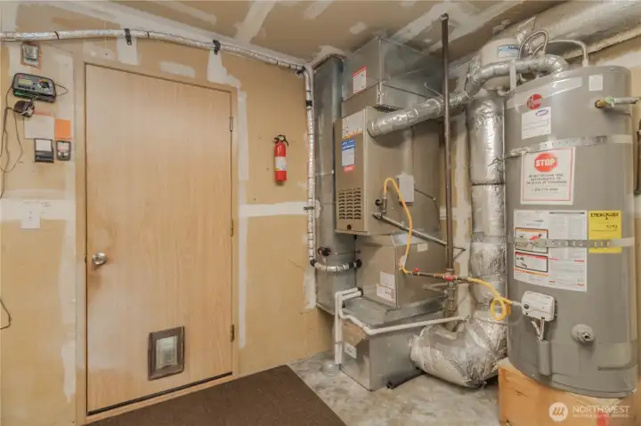 Garage with furnace and water heater. Sprinkler system in garage, seller never used.