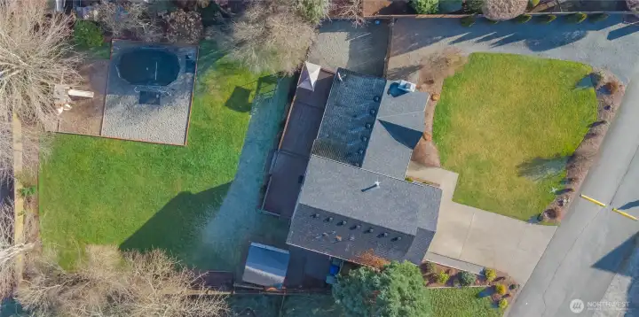 Huge lot with well-manicured landscaping and tons of parking and space to play.