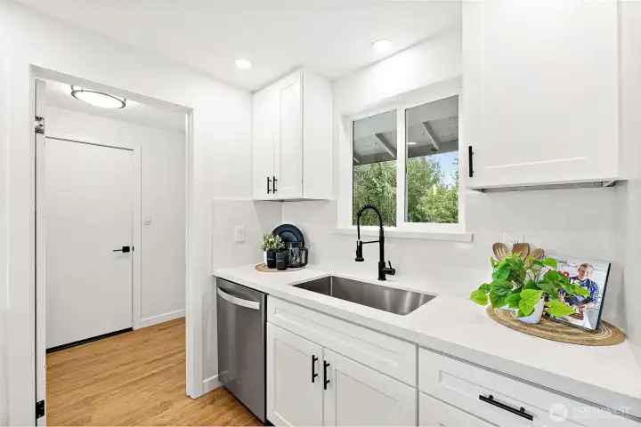 Laundry off kitchen. Pantry space on left