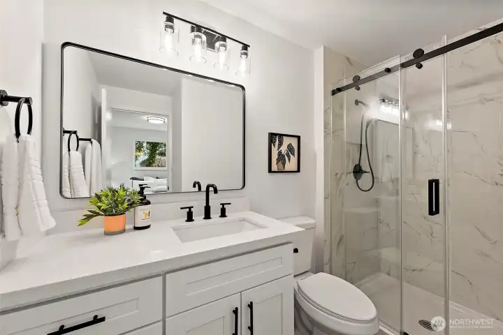 Primary bath - updated fixtures and tiled shower