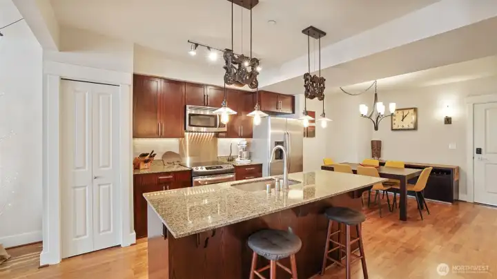 Center island kitchen with pantry and full size stainless steel appliances