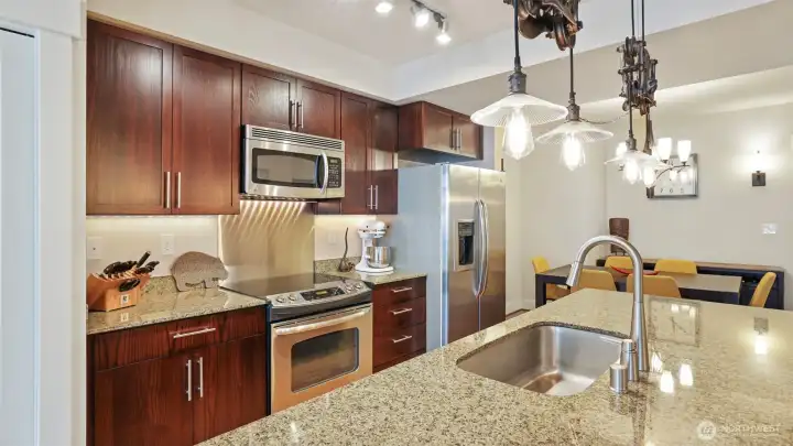 Center island kitchen with pantry and full size stainless steel appliances