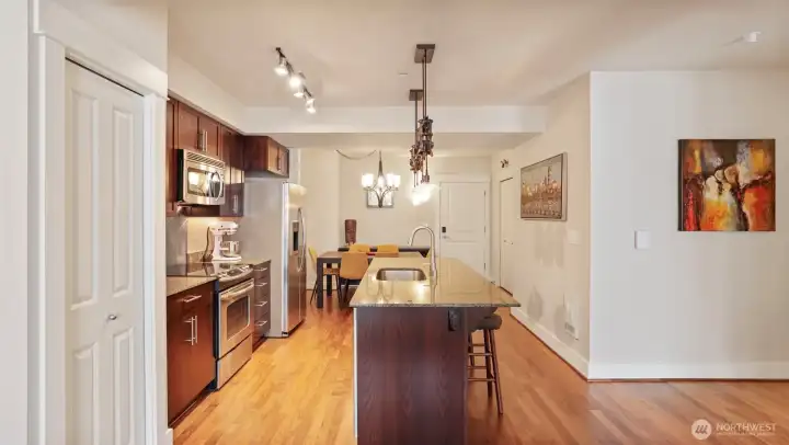 Center island kitchen with pantry and full size stainless steel appliances