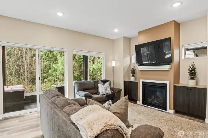 Spacious living room with gas fireplace.