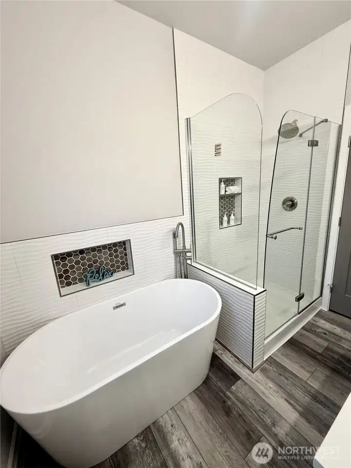 Downstairs primary suite large shower and soaking tub Downstairs primary suite large shower and soaking tub