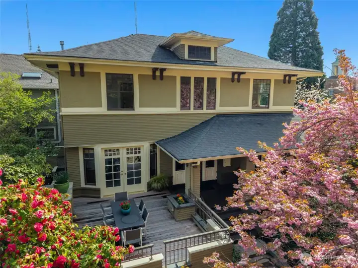 This 1907 Grand Craftsman sits on a prime corner lot atop Queene Anne Hill.