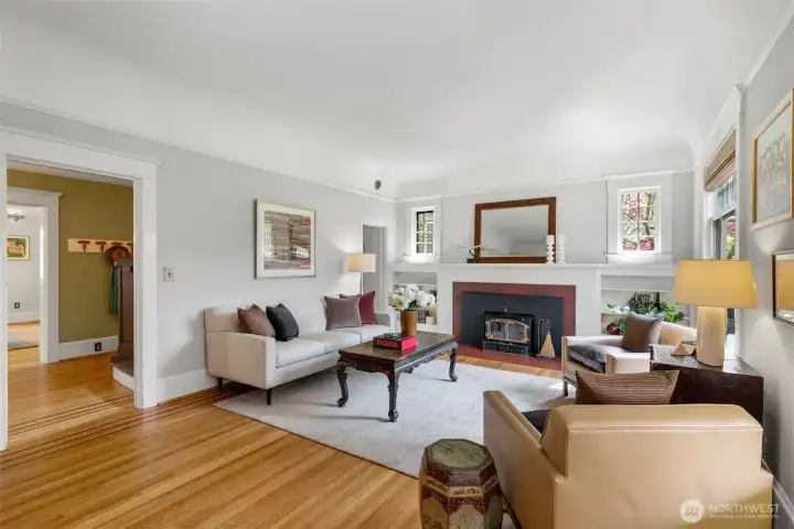 The entertainment-sized living room is centered around a wood-burning fireplace.