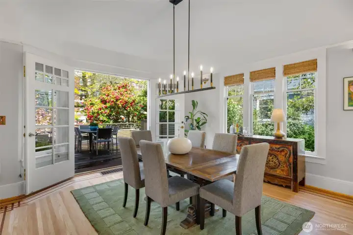 The formal, but open-concept dining room opens to the spacious deck for outdoor dining.