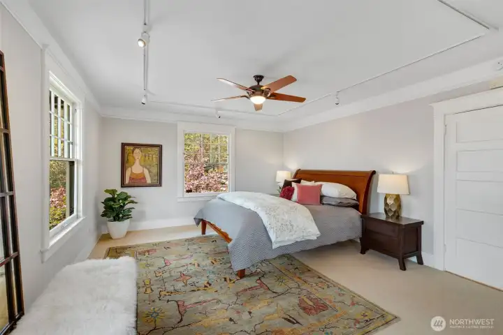 The main bedroom on the upper level is large.