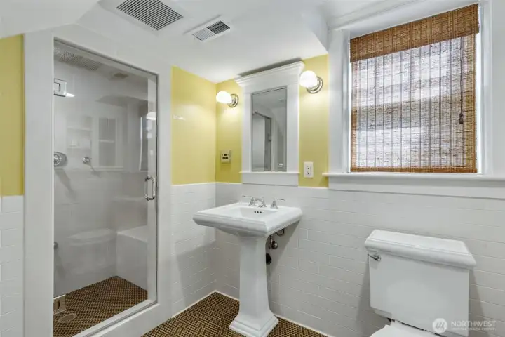 Bathroom features steam shower and heated floors.